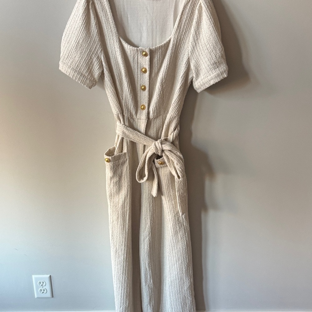 Storia Cream Textured Jumpsuit with Button Detail and pockets!